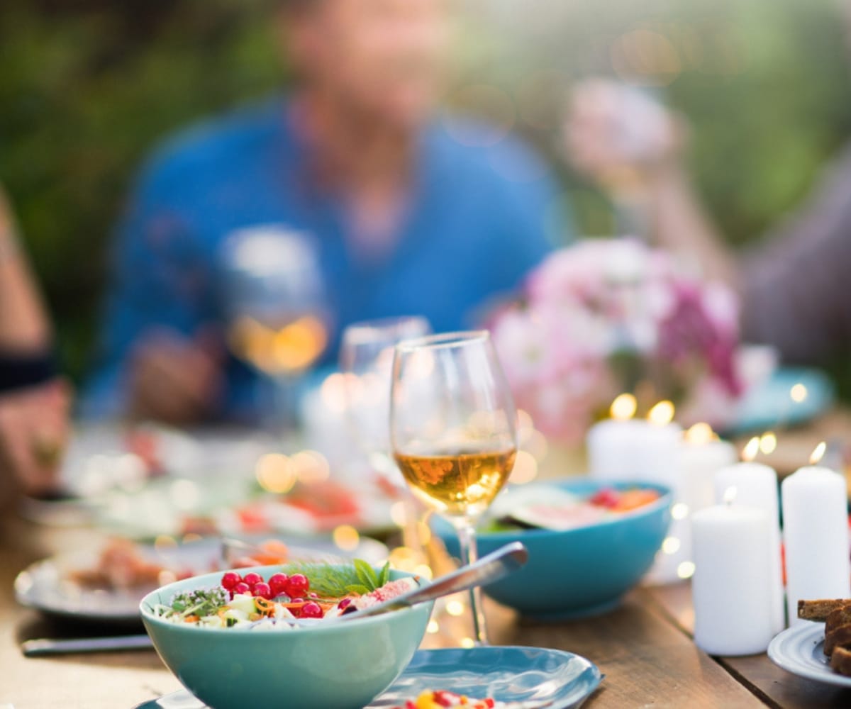 People eating al fresco under an awning