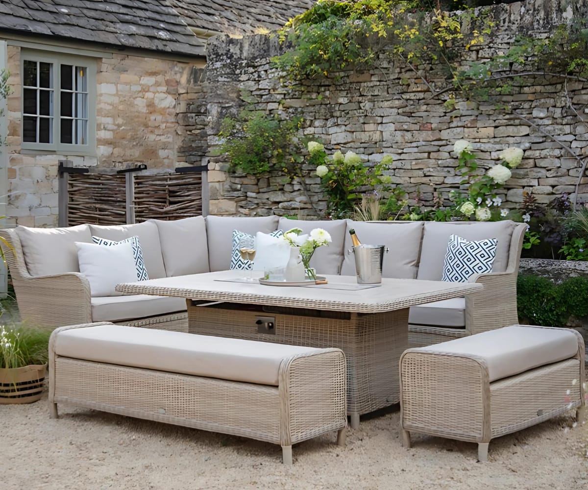 A set of luxury, high-end garden furniture in a stunning garden